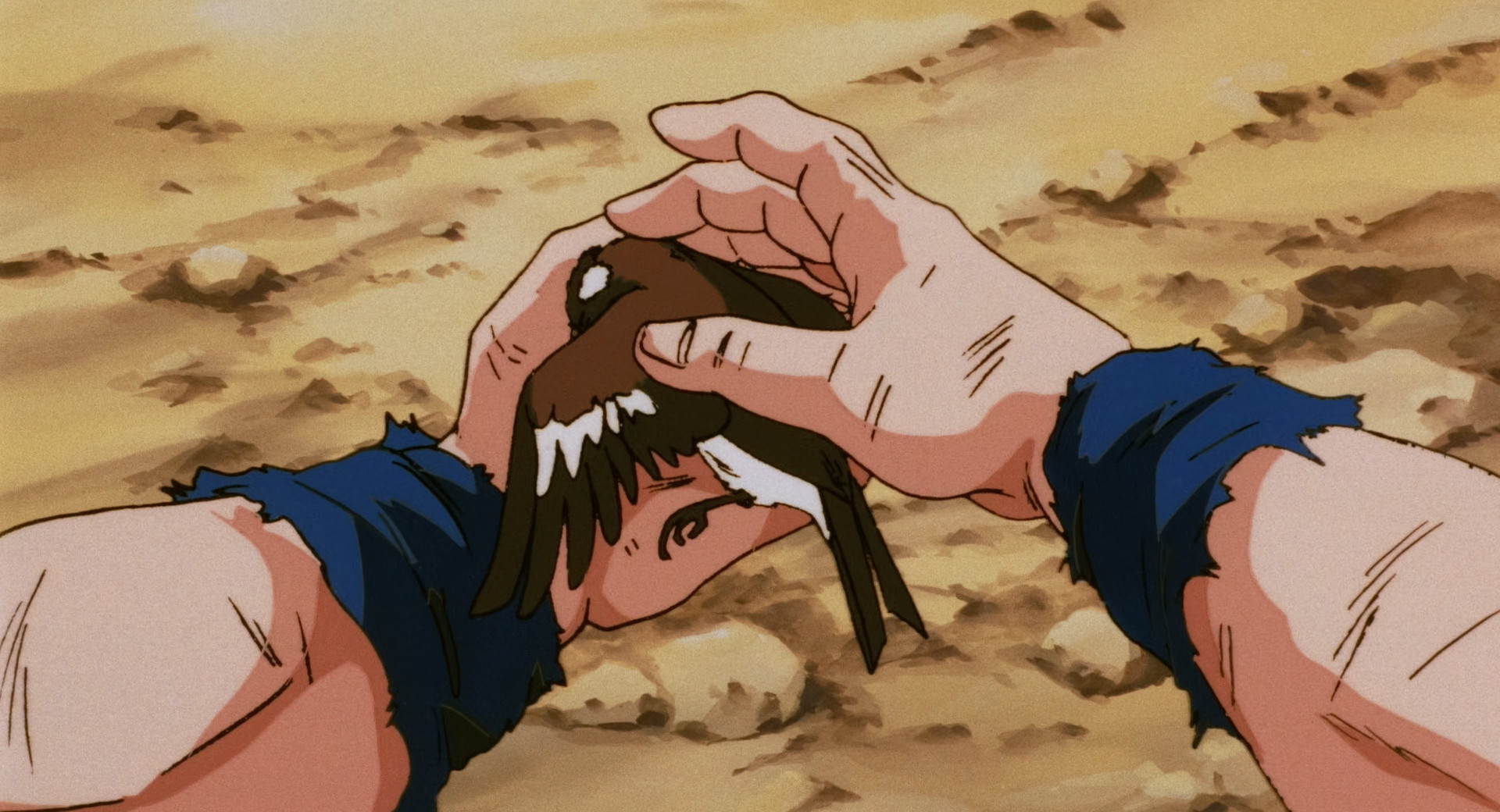 Goku cradles a dying bird