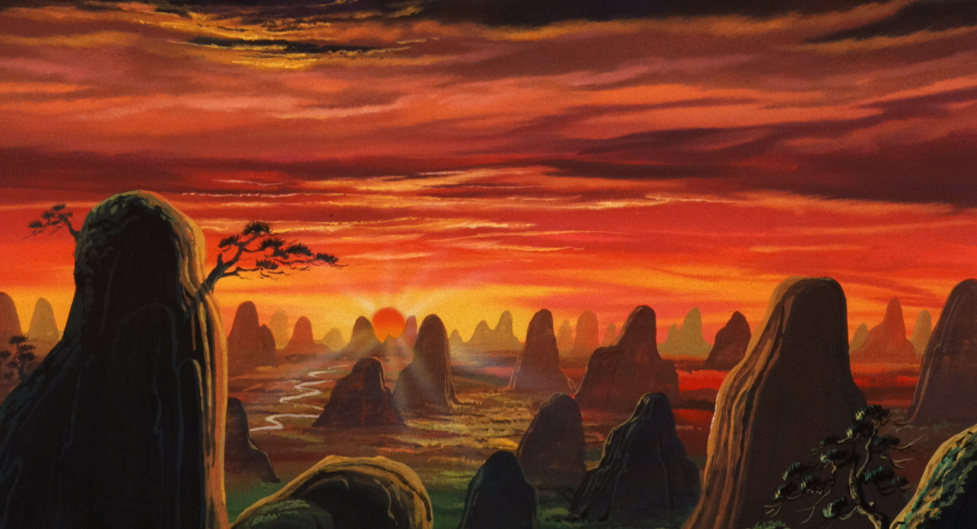 An establishing shot of the sunset seen over the mountains