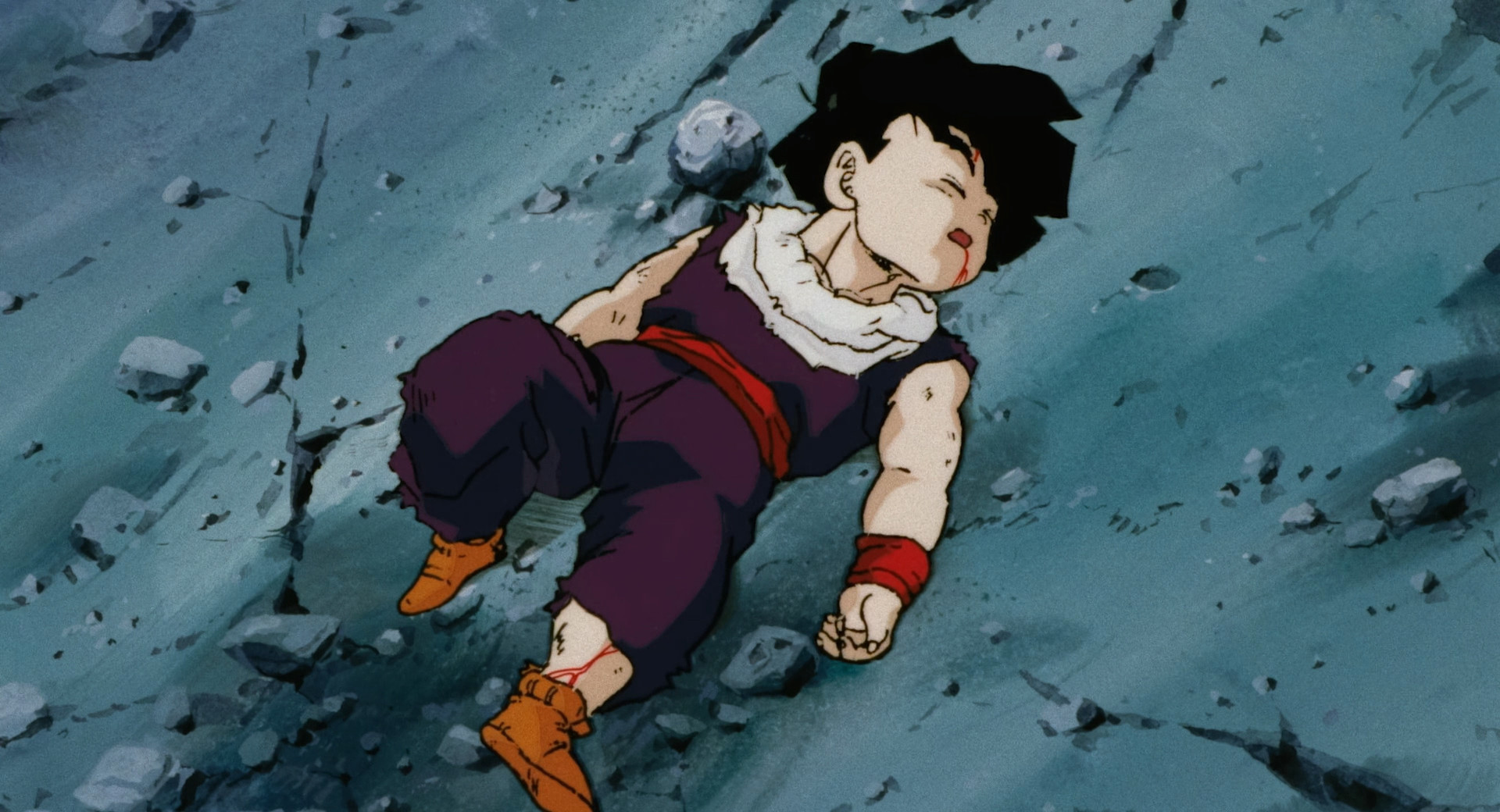 Gohan lying on the ground after having his energy drained